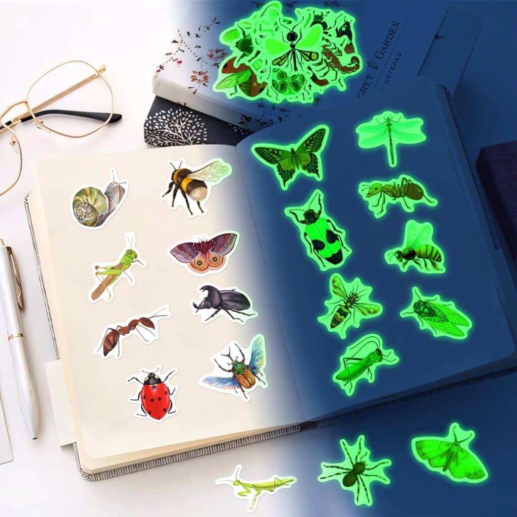 A Notebook Featuring Insect Stickers On One Page And Glow-In-The-Dark Insect Designs On Another, Displayed Alongside Glasses And A Pen.